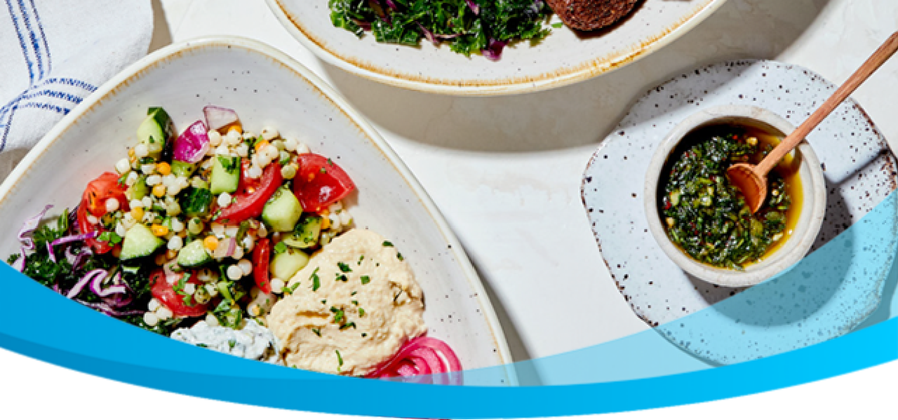 Overview of a table with Mediterranean dishes.